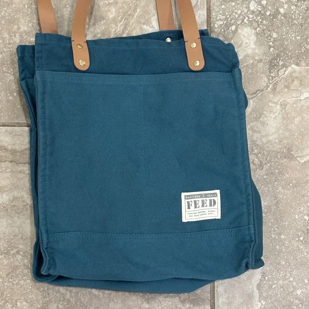 FEED Market Tote Bag Teal Blue Canvas Tan Straps Provides 3 Meals Grocery Bag
